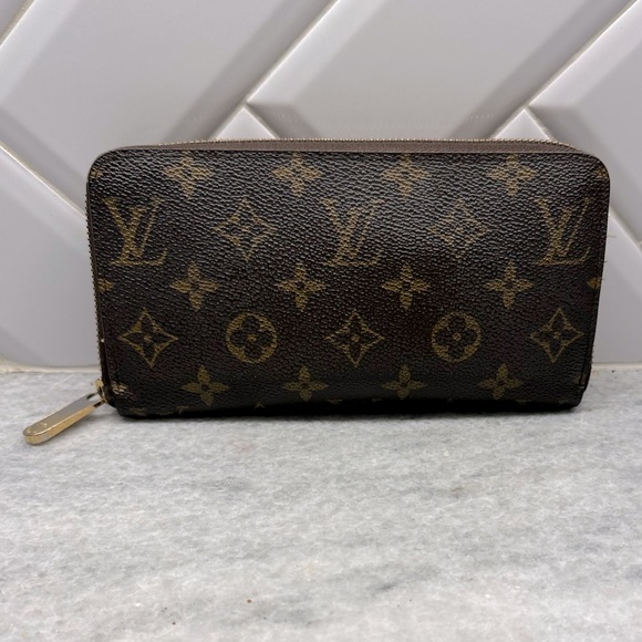Louis Vuitton Handbags - Louis Vuitton wallet 7.5 inches x 4 inches. Just a few years old. Authentic.